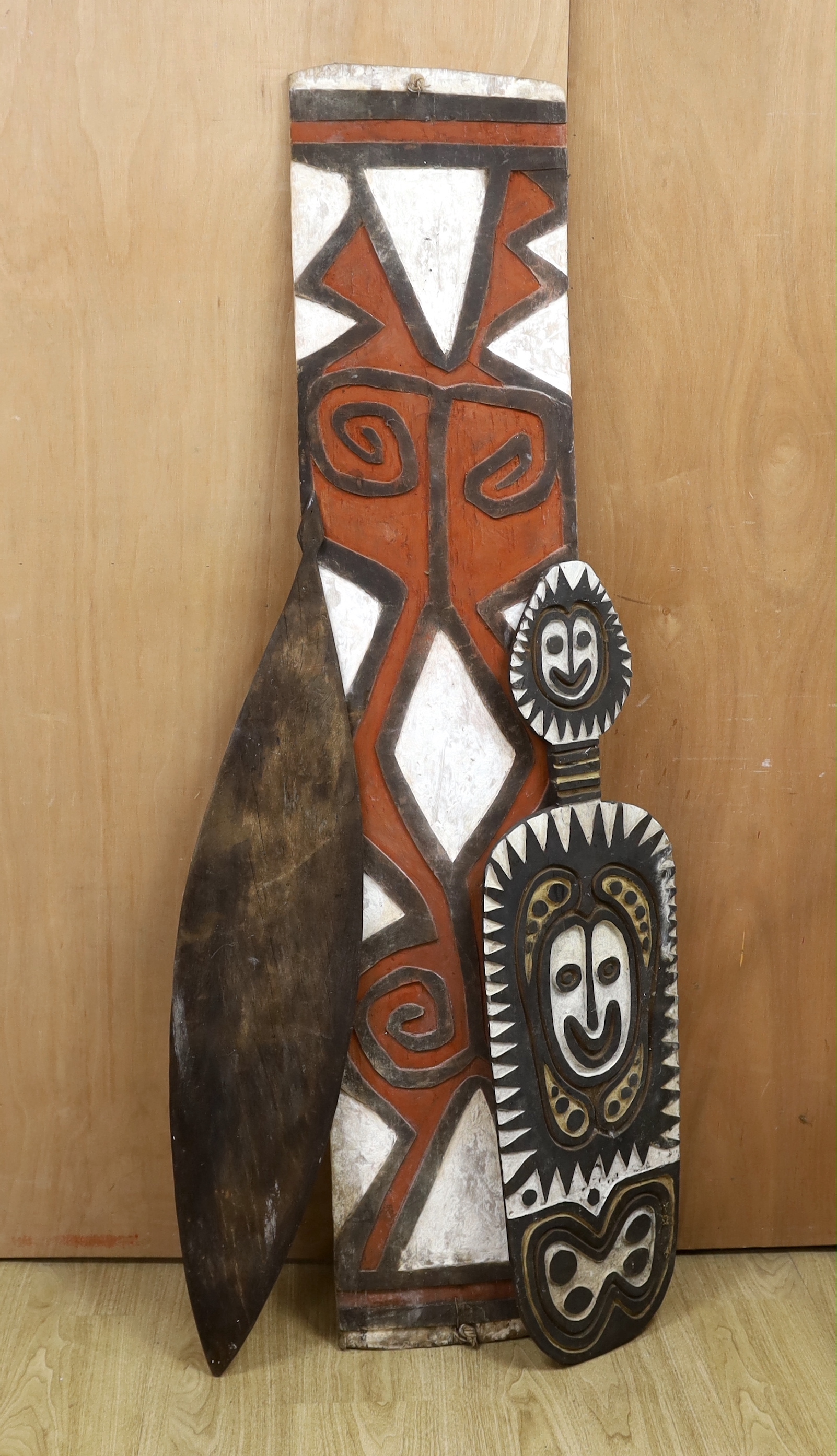 Three Papua New Guinea painted wooden shields, tallest 164cm